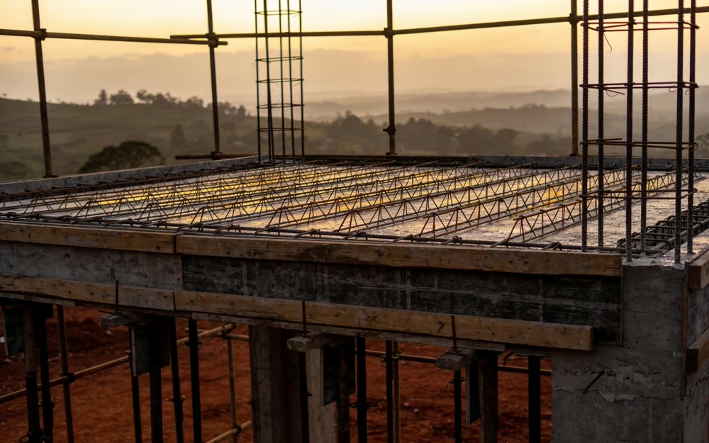 A concrete structure rising against a hazy East African sky